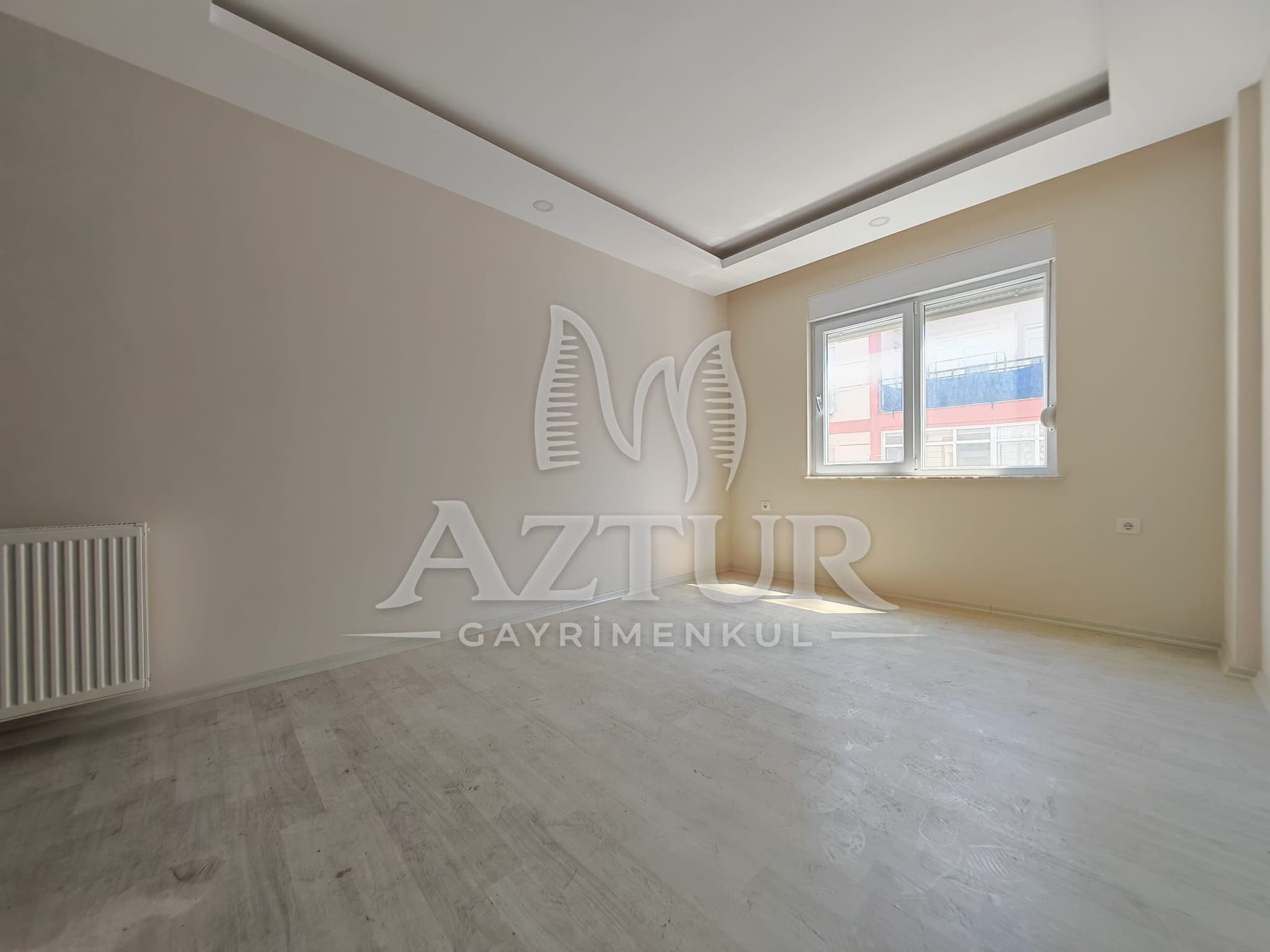 BÜYÜKŞEHİR BELEDİYESİNE YAKIN KONUMDA ARAKAT SIFIR 2+1 SATILIK DAİRE