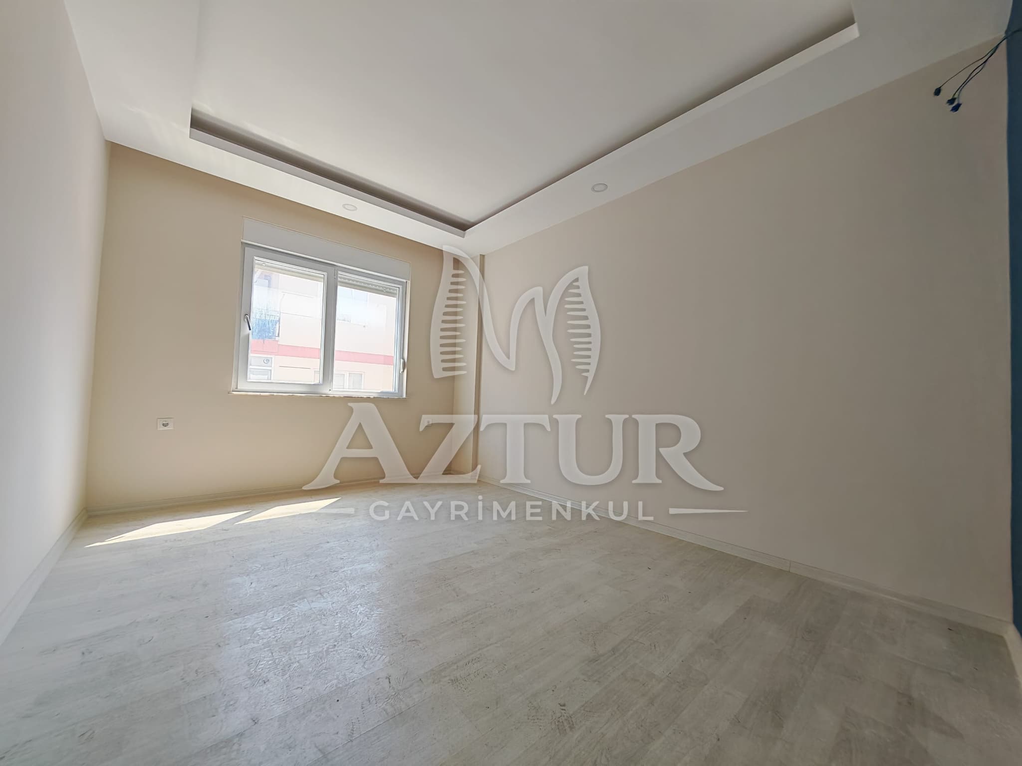 BÜYÜKŞEHİR BELEDİYESİNE YAKIN KONUMDA ARAKAT SIFIR 2+1 SATILIK DAİRE