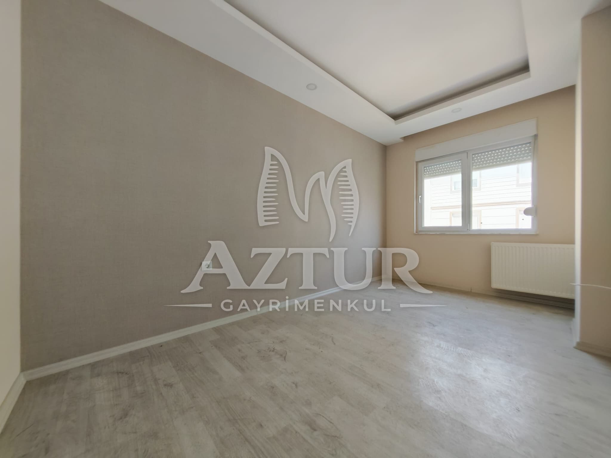BÜYÜKŞEHİR BELEDİYESİNE YAKIN KONUMDA ARAKAT SIFIR 2+1 SATILIK DAİRE